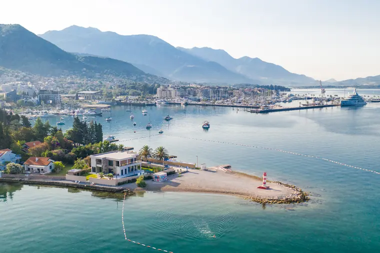 The point and its beach seen from the north, the marina beyond.
